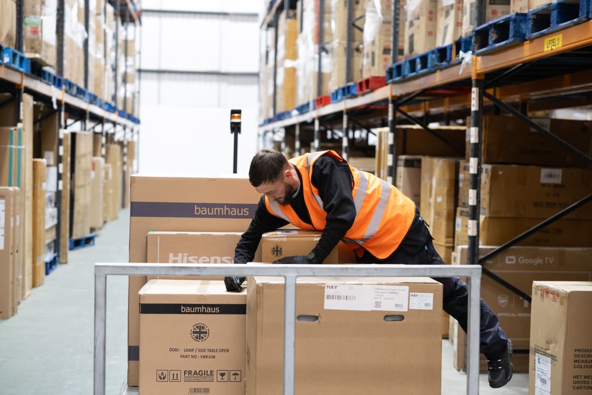 Warehouse-operative-loading-a-carriage.jpg