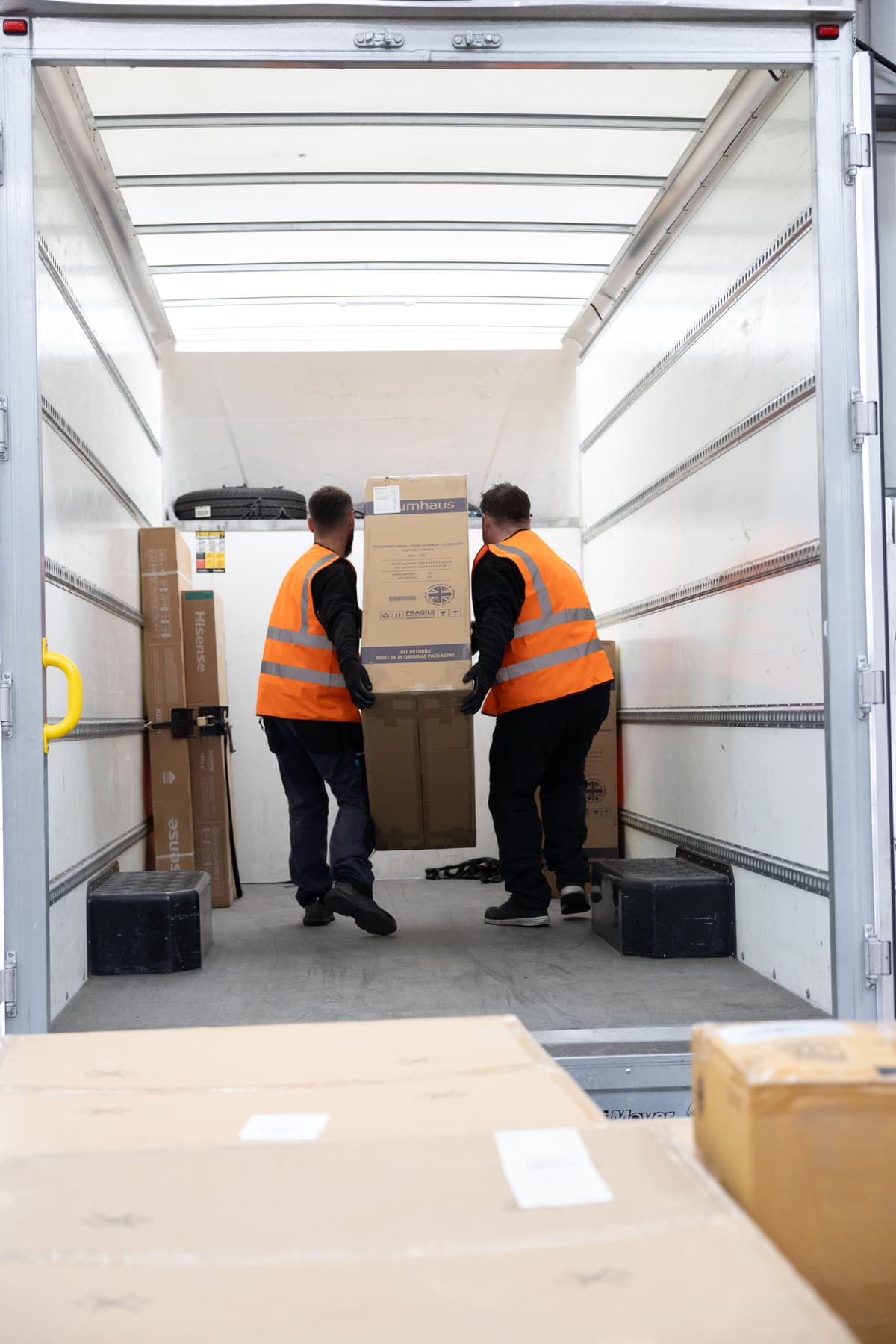 Warehouse-operative-loadning-items-onto-van.jpg