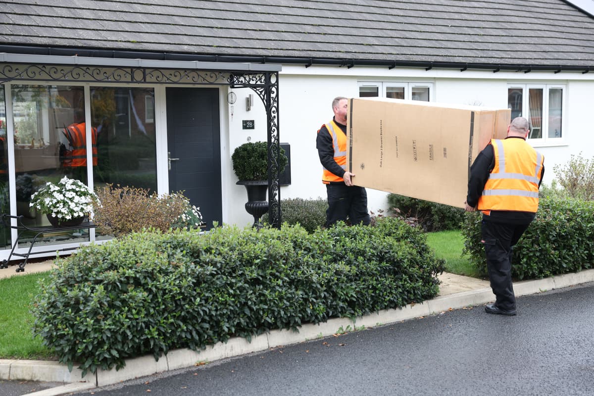 kinetic-delivery-drivers-delivering-furniture-to-a-customer-house.png